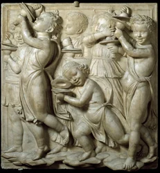 Pannello della Cantoria: bambino che suona i cembali. Alto rilievo in marmo di Luca della Robbia, 1431-1438. Museo dell