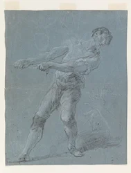 Giovane uomo che tira una corda