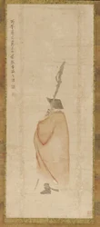 Uomo in piedi con cappotto rosso
