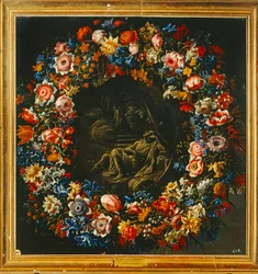 Corona di fiori con, al centro, una scena biblica