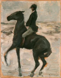 Cavaliere verso sinistra sulla spiaggia