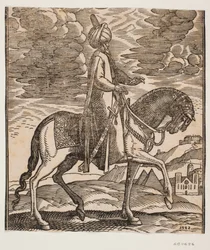 Cavaliere con turbante, con una spada al fianco destro, profilo verso destra; tra le zampe anteriori del cavallo, due piramidi in vista