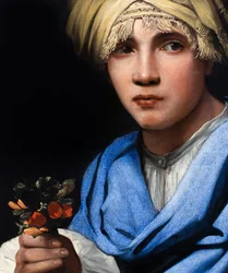 Ragazzo con turbante che tiene in mano un mazzo di fiori