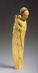 Figura di Guanyin con un bambino