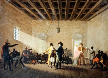 Un interno con mercanti di schiavi