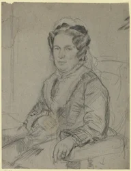 Anziana donna seduta con cuffia