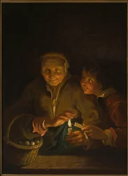 Vecchia e ragazzo con una candela