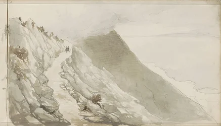 Figure su un sentiero lungo una costa rocciosa