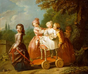 Un ragazzo su un cavallo a dondolo, con altri bambini che giocano in un giardino