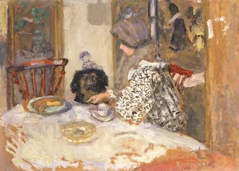 Donna con cane al tavolo