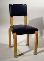 Sedia, di Pierre-Emile Legrain, in pelle blu e legno di sicomoro, stile Art Deco. Francia, XX secolo