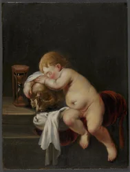 Ragazzo che dorme su un teschio