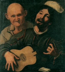 Un chitarrista e un vecchio che assiste