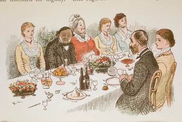 Persone sedute a un tavolo da pranzo.