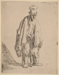 Mendicante con un berretto a tesa alta, in piedi e appoggiato a un bastone