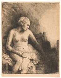 Donna al bagno, con un cappello accanto