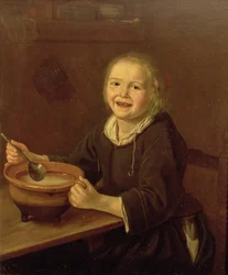 Ragazzo che mangia porridge