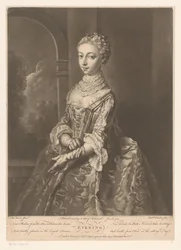 Donna con guanti vicino a una finestra