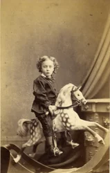 Bambino seduto su un cavallo a dondolo, 1860s