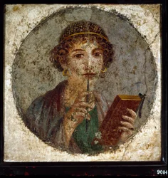 Ritratto presunto di Saffo, poetessa greca. Donna romana con libro e penna (stilo o stile), da Pompei, Napoli, Italia