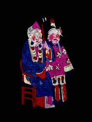 Coppia in abiti tradizionali. Taglio di carta dipinta o "Jian Zhi", arte popolare cinese, Pekin.