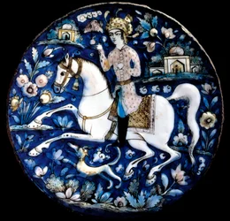Arte iraniana: piatto in ceramica policroma che rappresenta un cavaliere. XVI secolo Collezione privata