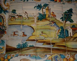 Piastrelle di azulejos raffiguranti un cacciatore che spara ai cervi