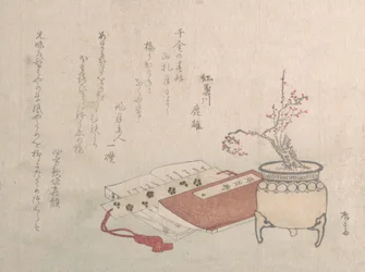 Albero di prugne in vaso in fiore e libri