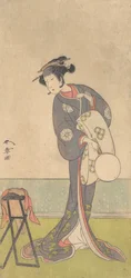Il primo Nakamura Tomijuro come Oiran in piedi in una stanza
