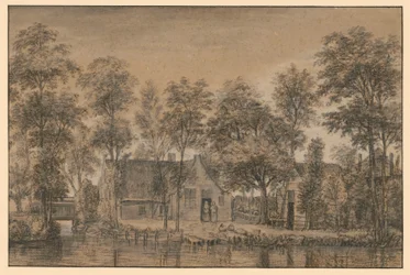 Cascina sotto gli alberi presso il canale