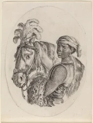 Stalliere nero con un cavallo arabo