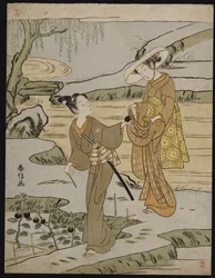 Una scena estiva su un argine rialzato di un giovane che taglia una melanzana da dare alla sua giovane compagna