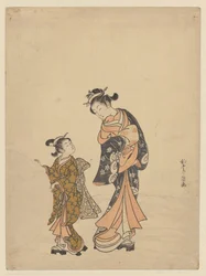 Giovane donna e ragazza con palla di neve