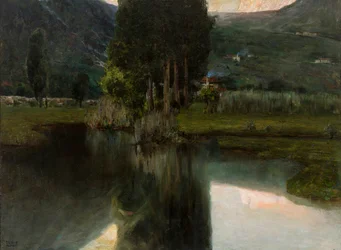 Lago con cipressi e case