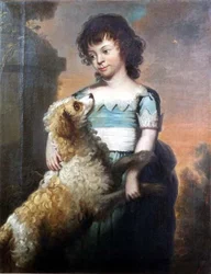 Ritratto di una ragazza in un vestito blu con un cane