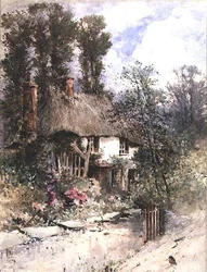 Un cottage con tetto di paglia in estate