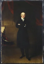 Ritratto di George Canning, a figura intera, in piedi con un cappotto nero in un interno, con le braccia incrociate