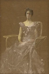 Signora in poltrona di rattan