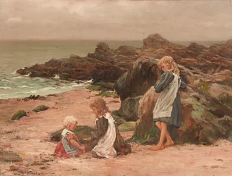 Bambini su una spiaggia rocciosa