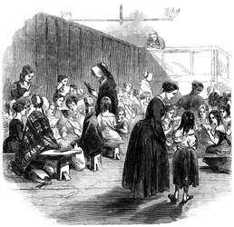 Insegnare alle ragazze a leggere nella scuola della Ragged School Union, Lambeth, Londra, 1868
