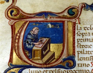 Monaco copista nel suo scriptorium, miniatura
