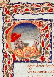 L’astronomo greco Claudio Tolomeo (Claudius Ptolemaeus) (circa 90-circa 168 d.C.) usa un compasso per eseguire calcoli. Miniatura tratta dalla «Cosmographia» (Ms. V.F. 32 f.2r), Napoli, Biblioteca Nazionale