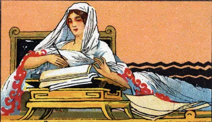 Storia della scrittura: una giovane donna che scrive su un quaderno in latino, inizio del XX secolo (cromo)