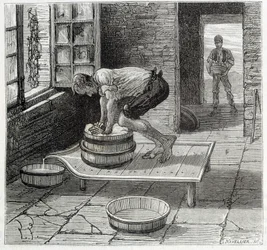 Lavoro della Tomme da parte di un casaro dell