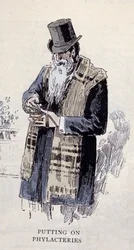 Religione ebraica: un vecchio ebreo che indossa il talit (o tzitzit), incisione del 1890