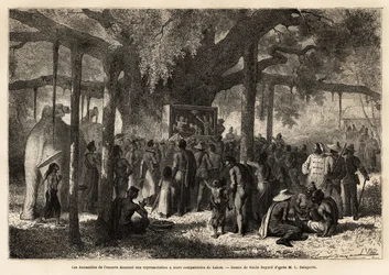 Gli annamiti della scorta di Garnier danno una rappresentazione improvvisata ai loro compatrioti a Lakon (Laos), dopo aver allestito un piccolo teatro di marionette ai piedi di un baniano con un enorme tronco. Incisione per illustrare il viaggio di esplora
