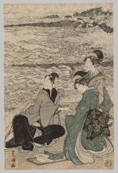 Uomo e due donne sulla riva del mare