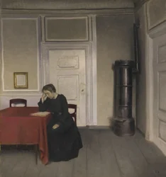 Interno con donna che legge