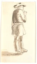 Uomo in piedi che fuma una pipa