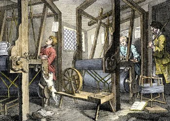 Laboratorio e operaio con materiale da tessere a Spitalfields, Inghilterra